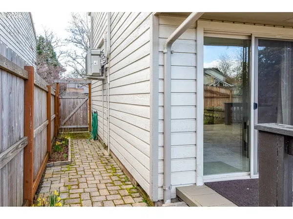 a balcony with wooden floor and outdoor space