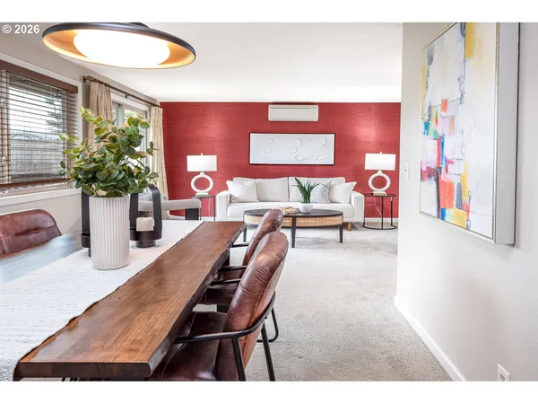 a living room with furniture and potted plant