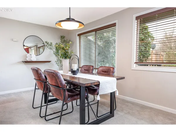 a view of a dining room with furniture window and outside view