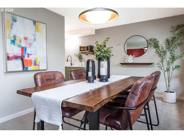 a dining room with furniture and window