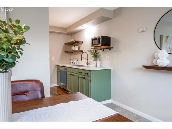 a bedroom with a bed and a television