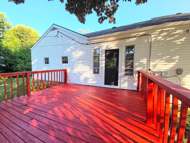 a balcony with wooden floor
