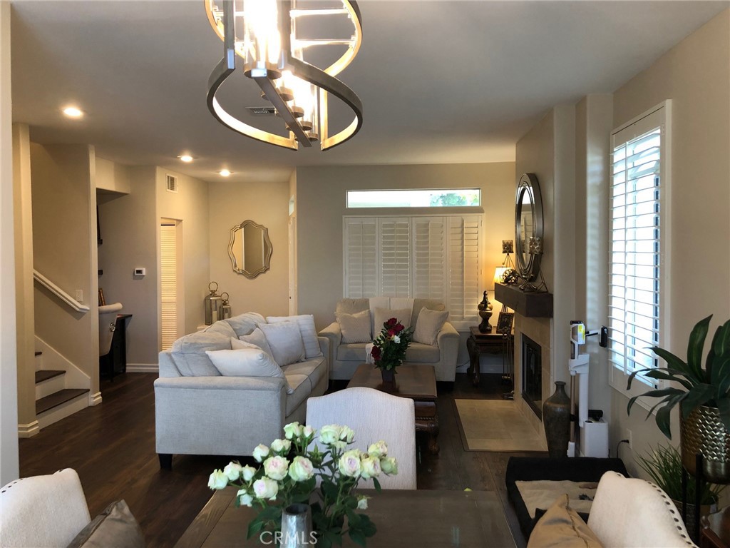 25530 Hemingway Avenue Stevenson Ranch, CA 91381 - Photo 11 of 29 a living room with furniture chandelier and a mirror