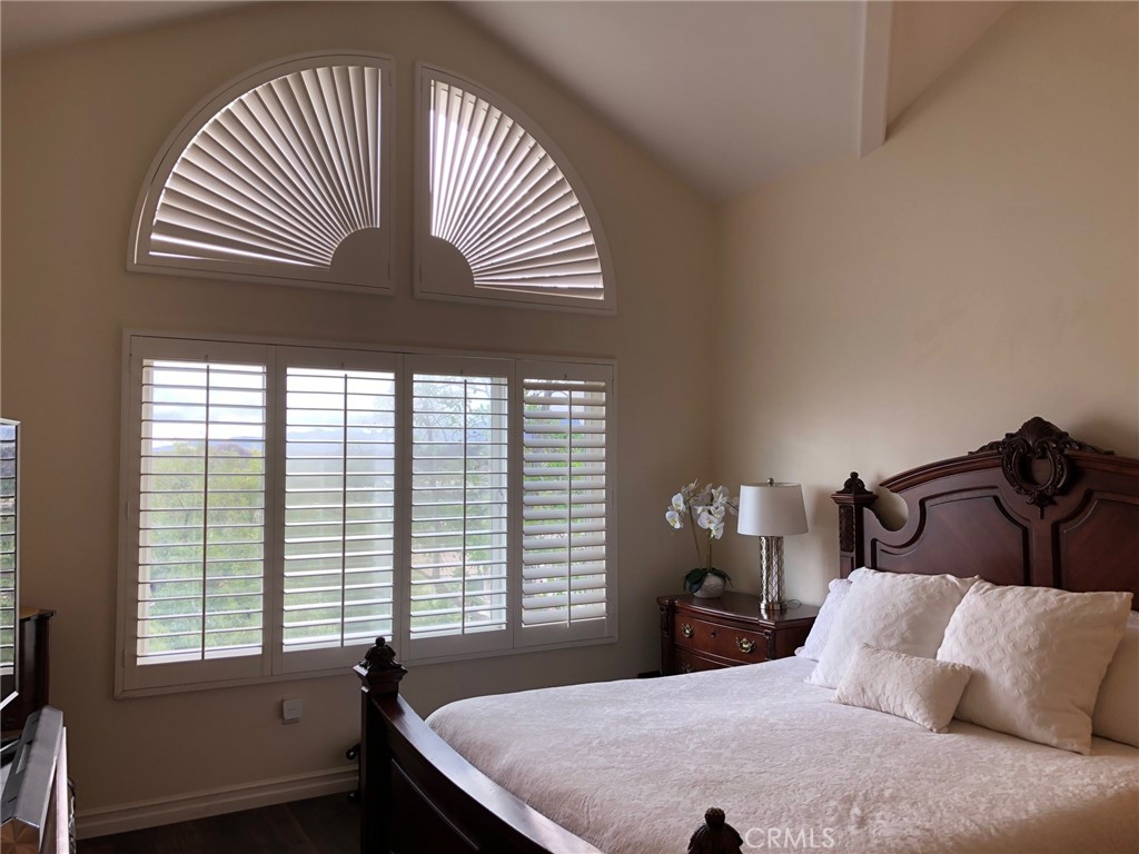 25530 Hemingway Avenue Stevenson Ranch, CA 91381 - Photo 18 of 29 a bedroom with a bed and a window