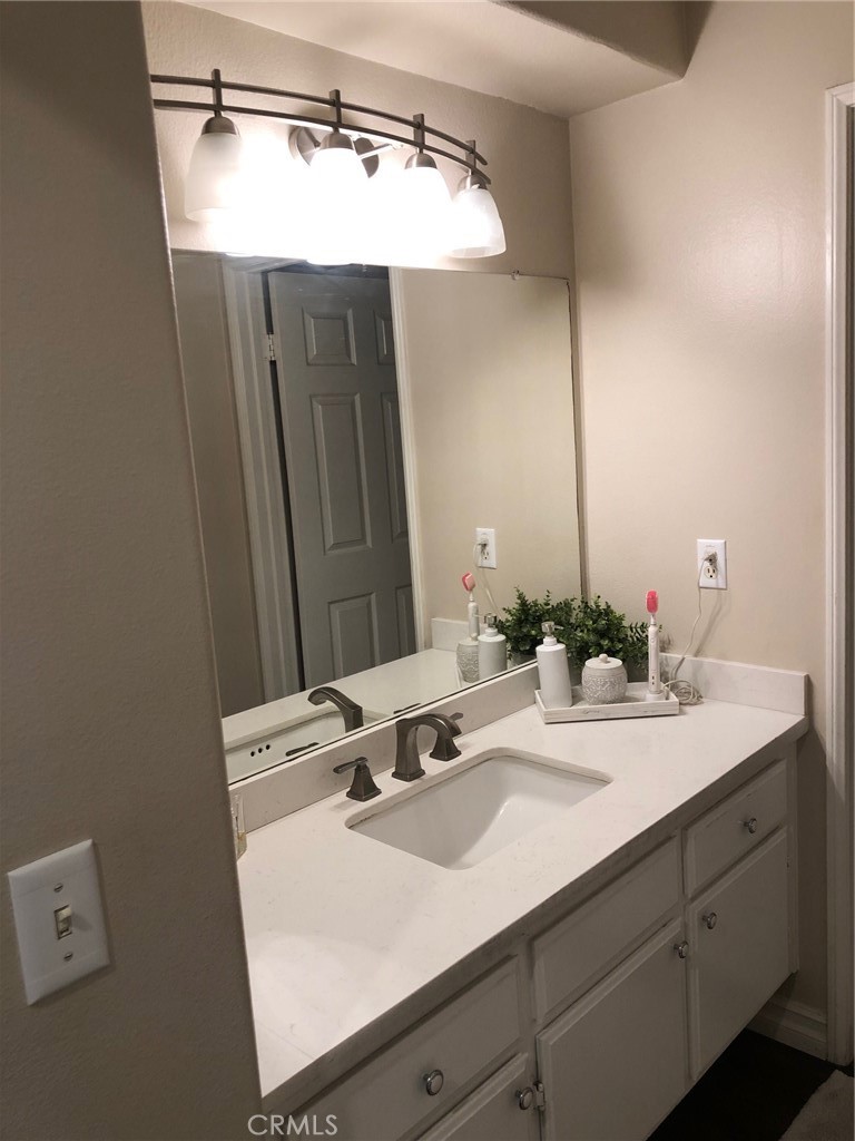 25530 Hemingway Avenue Stevenson Ranch, CA 91381 - Photo 23 of 29 a bathroom with a sink and a mirror