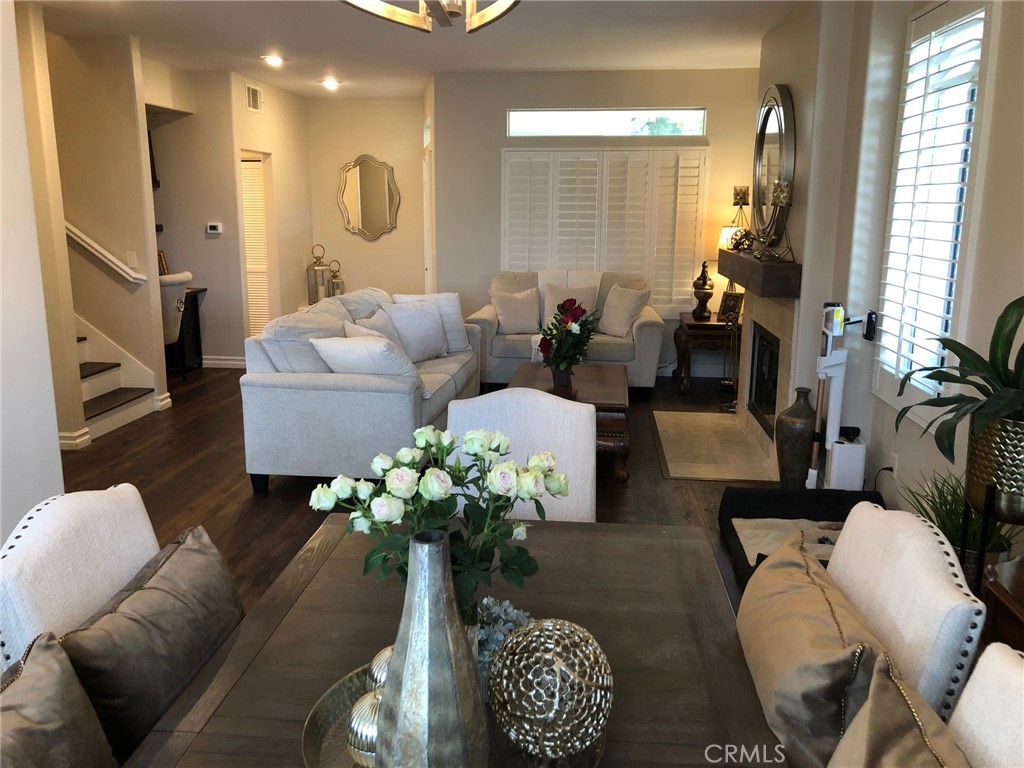 25530 Hemingway Avenue Stevenson Ranch, CA 91381 - Photo 10 of 29 a living room with furniture flowerpot and wooden floor