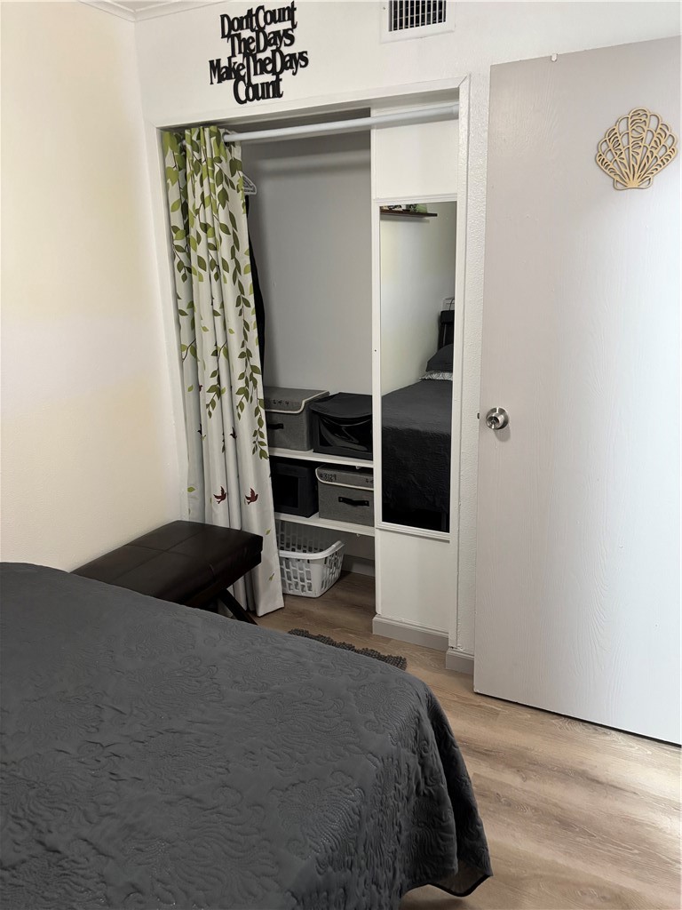 3938 Surfside Boulevard, Unit 3129 Corpus Christi, TX 78402 - Photo 14 of 39 a bedroom with a bed and a window