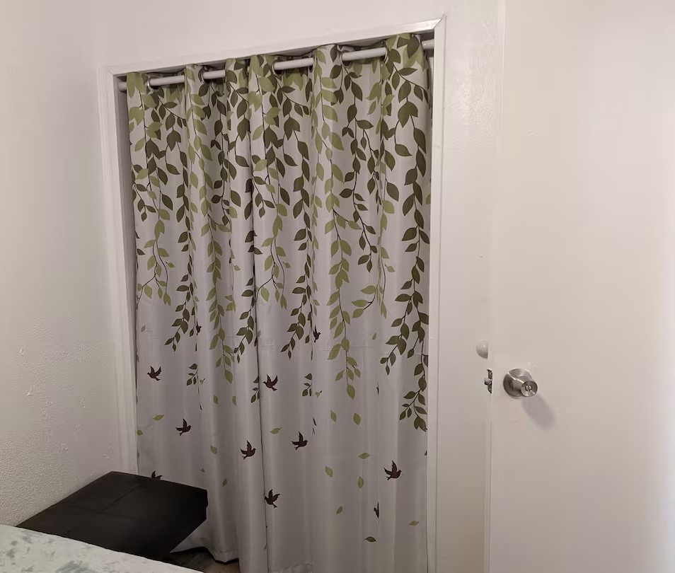 3938 Surfside Boulevard, Unit 3129 Corpus Christi, TX 78402 - Photo 17 of 39 a bathroom with a shower curtain and a sink