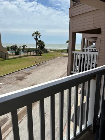a view of a swimming pool with outdoor seating