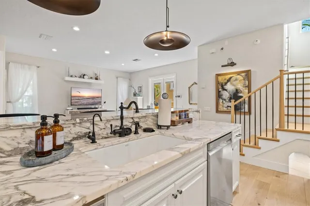 a kitchen with a stove and wooden cabinets