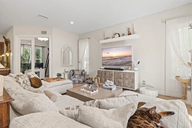 a kitchen with stainless steel appliances a refrigerator and cabinets