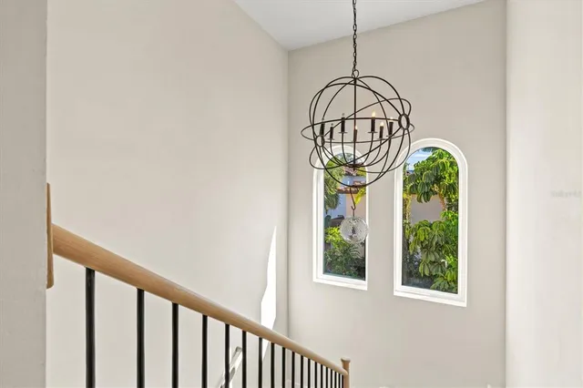 a room with gym equipment and glass door