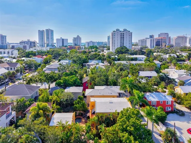 a front view of a house with a yard and sitting area