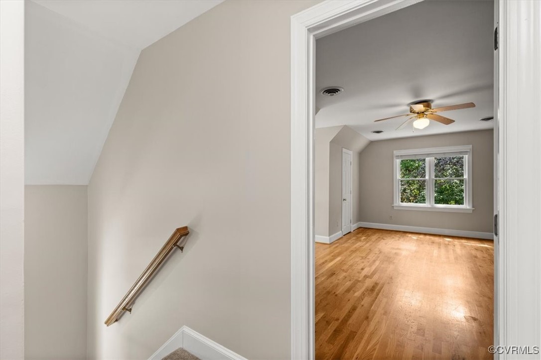 607 Rivers Bend Circle Chester, VA 23836 - Photo 25 of 40 a view of an empty room with wooden floor and a window