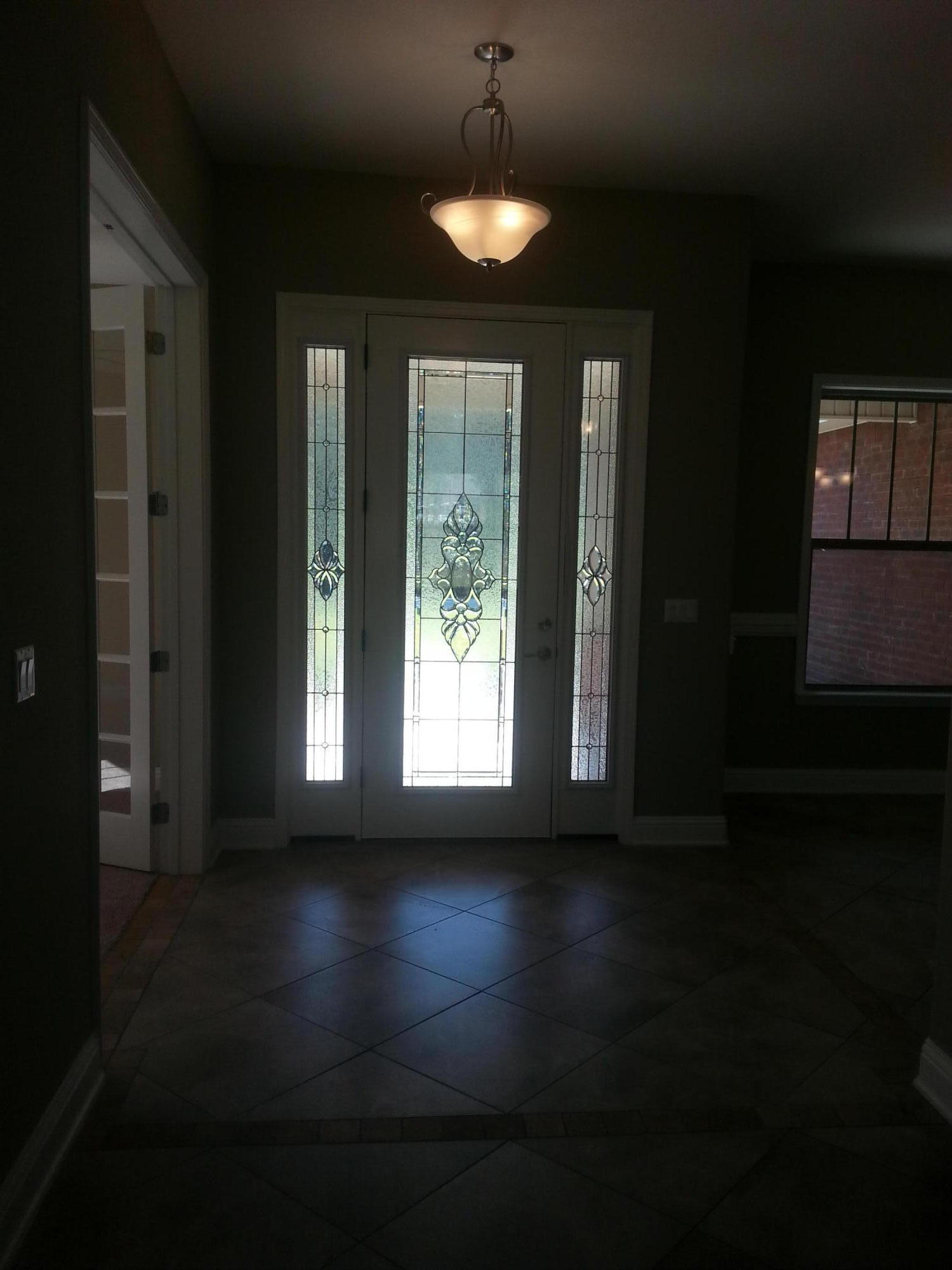 2442 Cove Road Navarre, FL 32566 - Photo 2 of 23 a view of a livingroom with furniture wooden floor and a chandelier