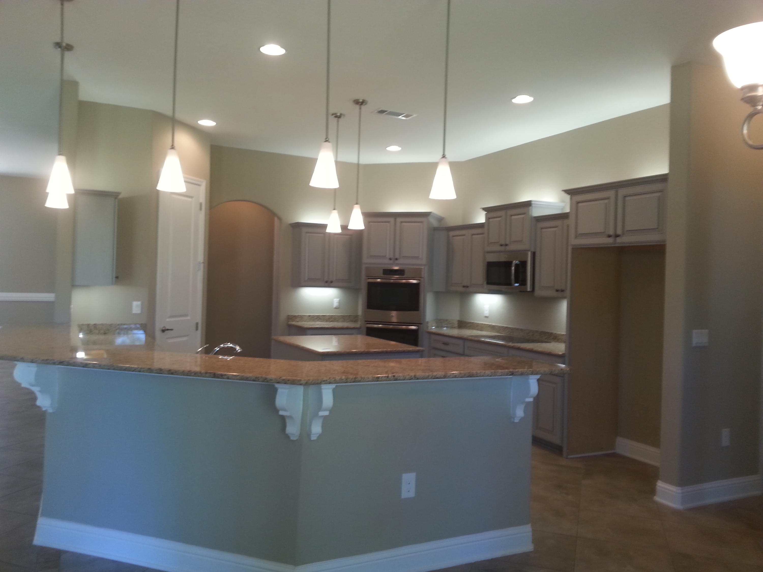 2442 Cove Road Navarre, FL 32566 - Photo 11 of 23 a large kitchen with a large counter top space