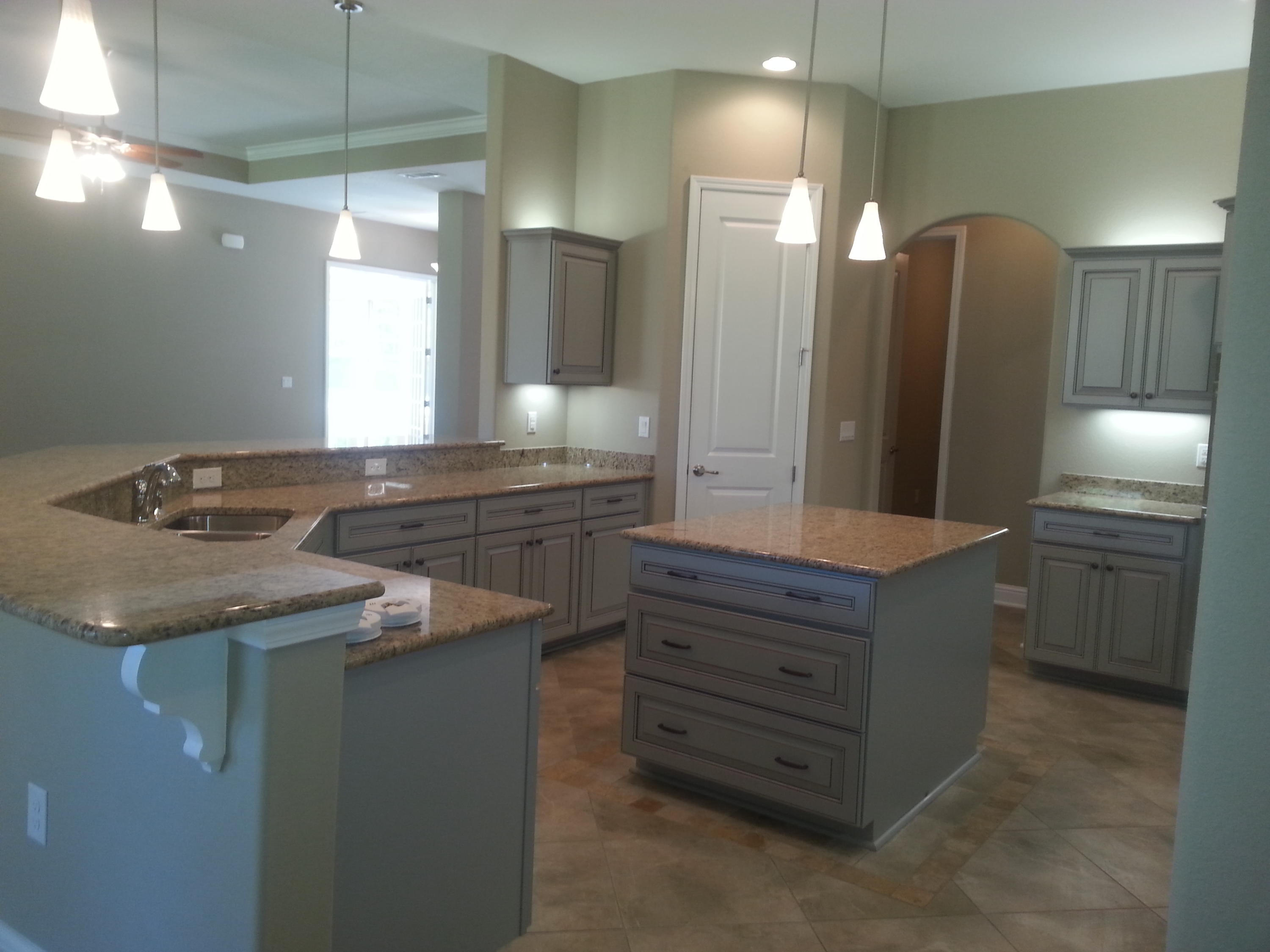 2442 Cove Road Navarre, FL 32566 - Photo 12 of 23 a bathroom with a granite countertop sink a large mirror and a shower