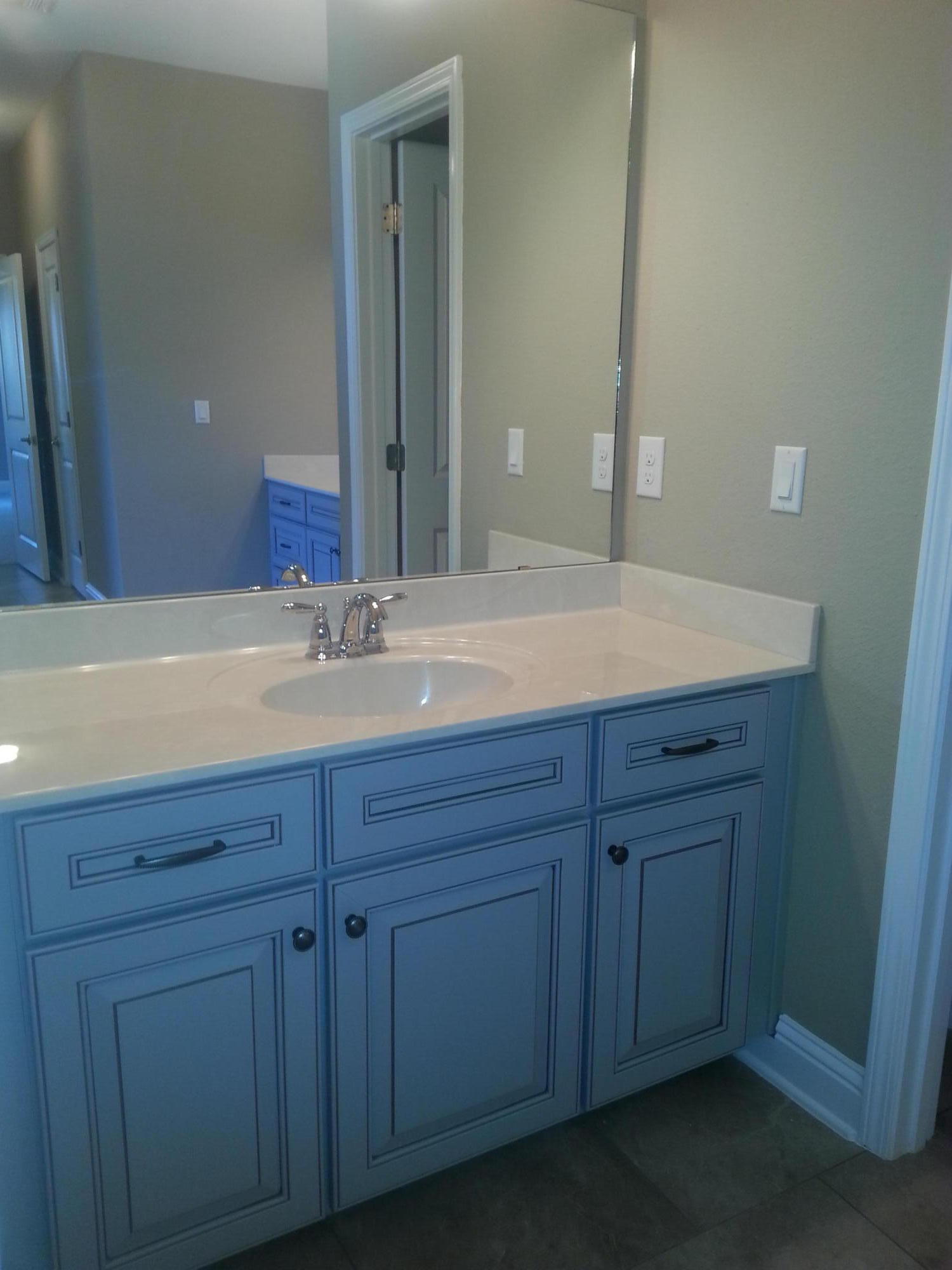 2442 Cove Road Navarre, FL 32566 - Photo 20 of 23 a bathroom with a sink and a mirror