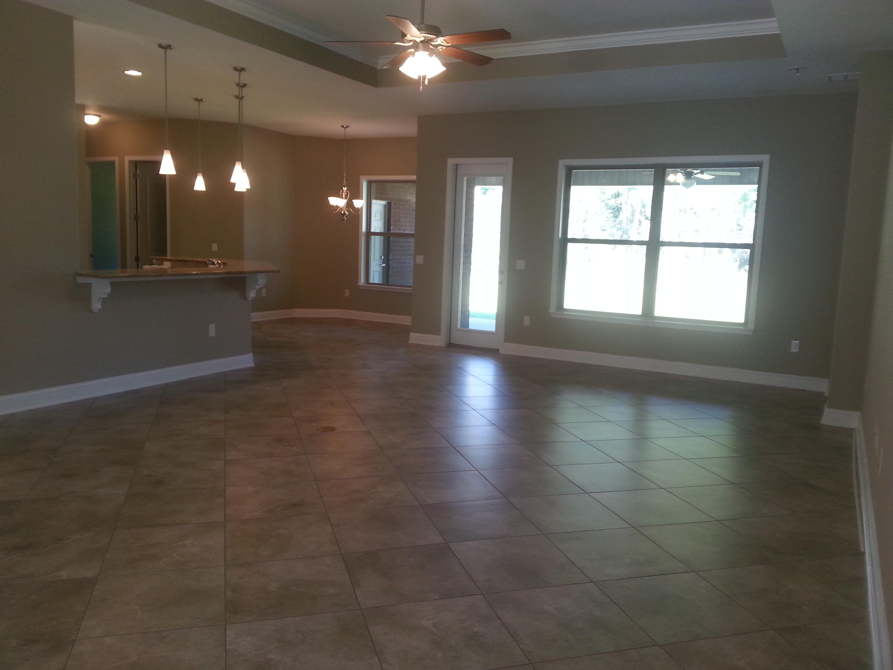 2442 Cove Road Navarre, FL 32566 - Photo 6 of 23 a view of an empty room with a window