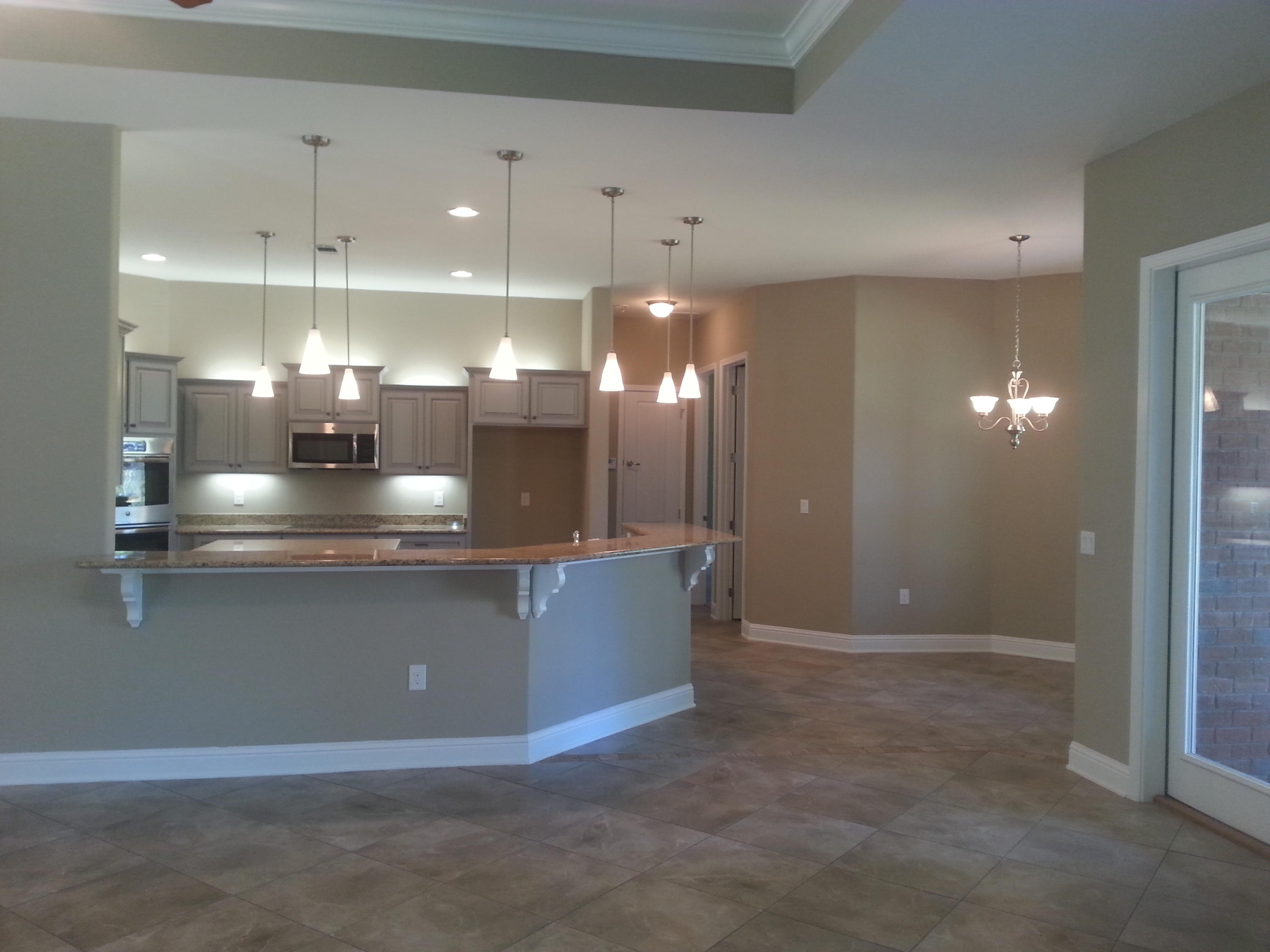 2442 Cove Road Navarre, FL 32566 - Photo 10 of 23 a view of kitchen with refrigerator and window