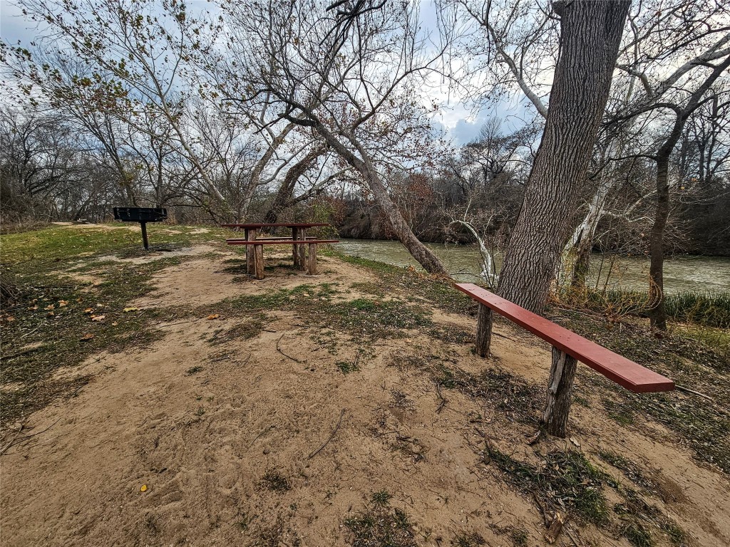 420 Riverside Drive Bastrop, TX 78602 - Photo 5 of 8 a view of a yard with a tree