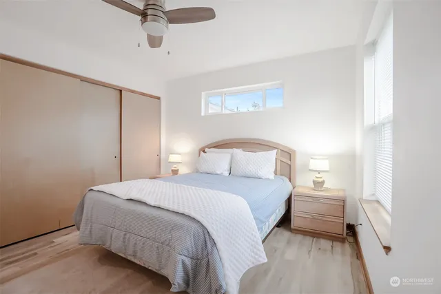 a bedroom with a bed and window