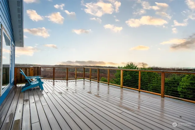 a view of balcony with deck and wooden floor