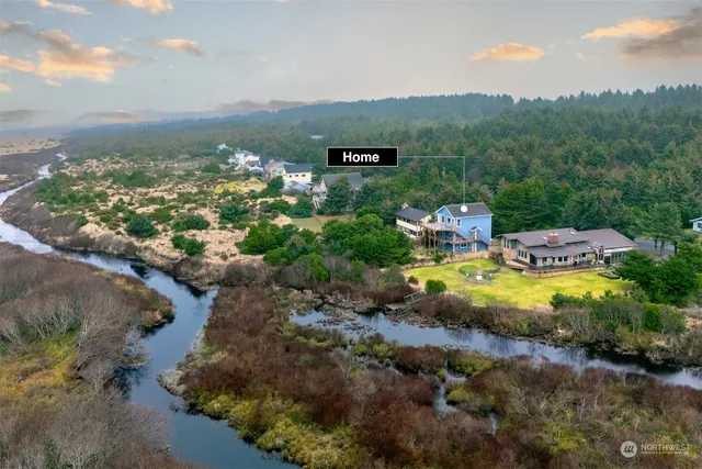 an aerial view of residential building and lake