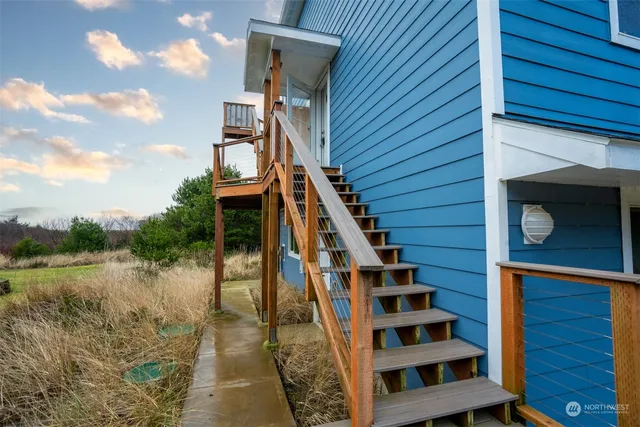 a view of stairs and wooden floor