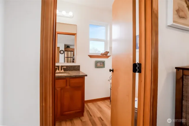 hallway with wooden floor and furniture