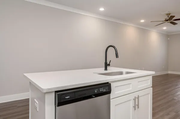 a kitchen with a sink and a large window