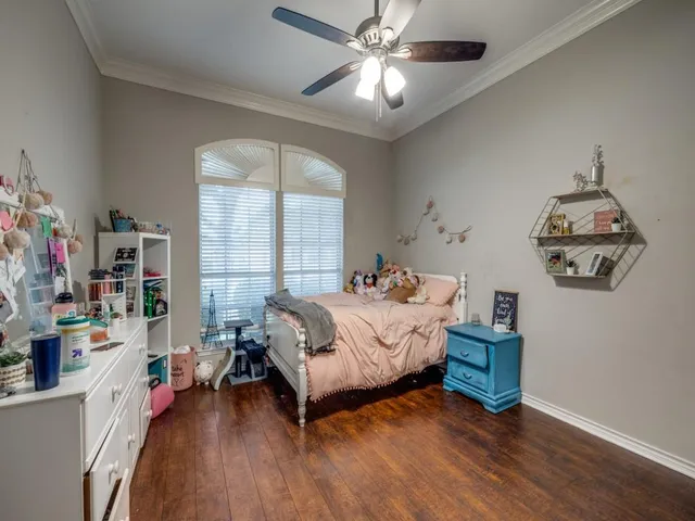 a bed room with a bed and a window