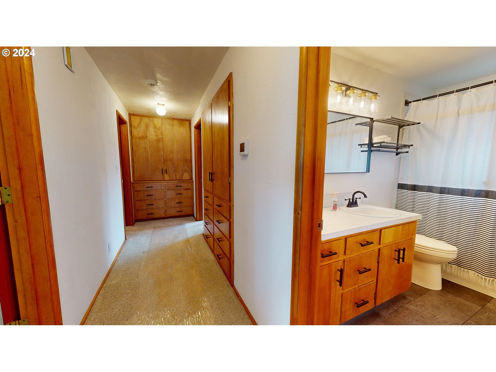 4675 Daisy Street Springfield, OR 97478 - Photo 14 of 43 a bathroom with a toilet a sink and a mirror