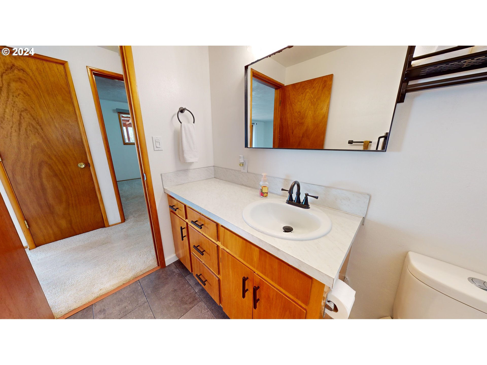 4675 Daisy Street Springfield, OR 97478 - Photo 16 of 43 a bathroom with a sink double vanity and a mirror