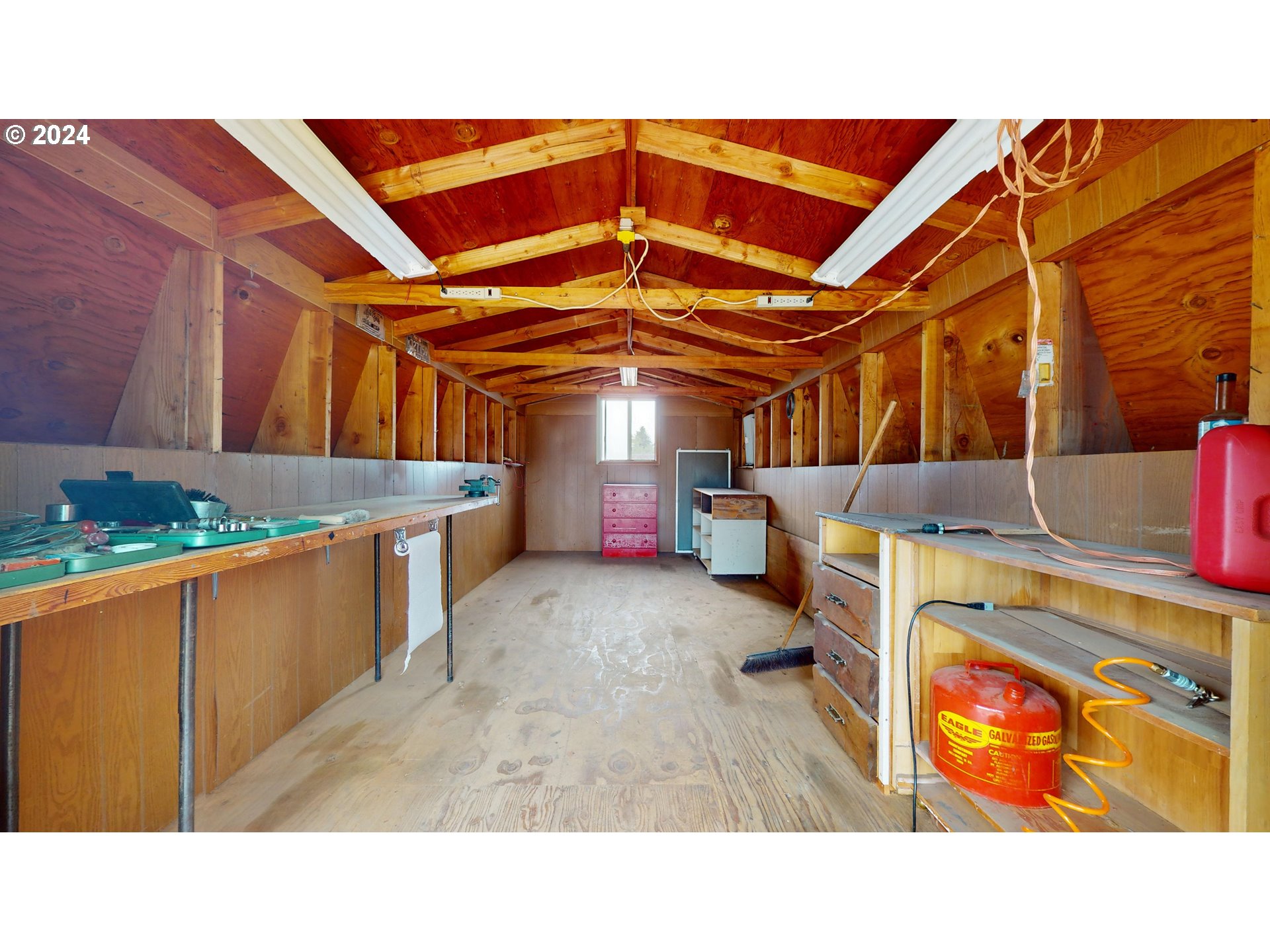 4675 Daisy Street Springfield, OR 97478 - Photo 34 of 43 a garage room with a chair and white walls