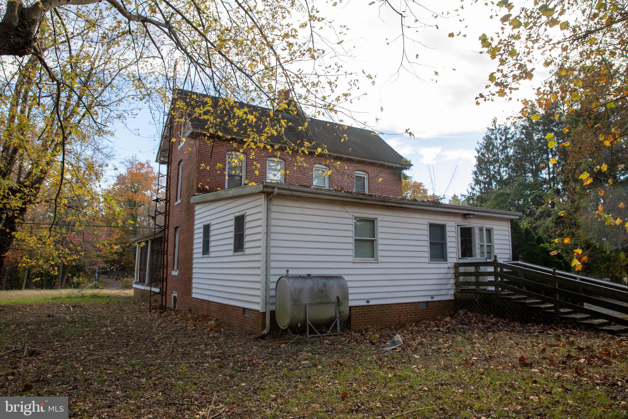 26121 Lewes Georgetown Highway Georgetown, DE 19947 - Photo 14 of 72 a backyard of a house with lots of green space