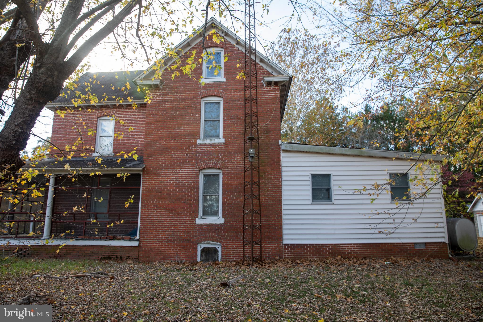 26121 Lewes Georgetown Highway Georgetown, DE 19947 - Photo 15 of 72 a front view of a house with garden