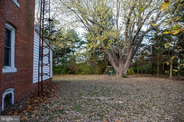 a picture of a room with a white wall and picture