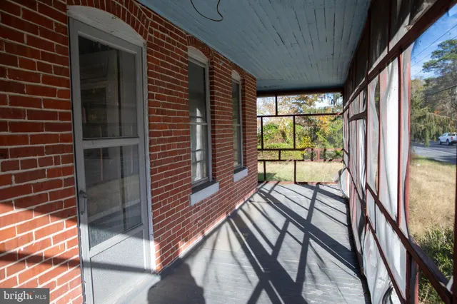 a kitchen with a stove a sink and a microwave