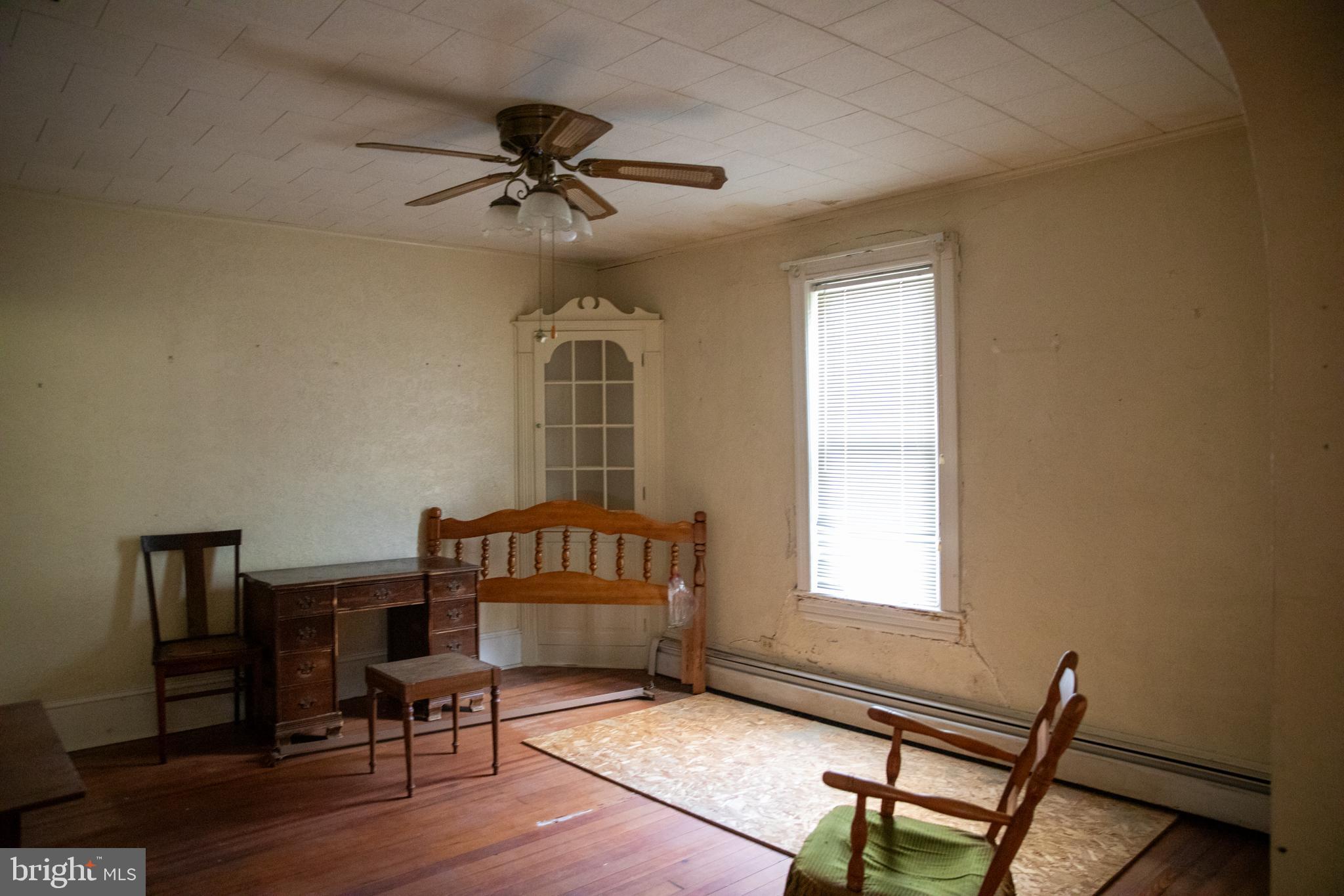 26121 Lewes Georgetown Highway Georgetown, DE 19947 - Photo 31 of 72 a bedroom with furniture window and wooden floor