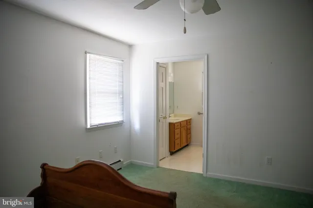 a bathroom with a sink and a window