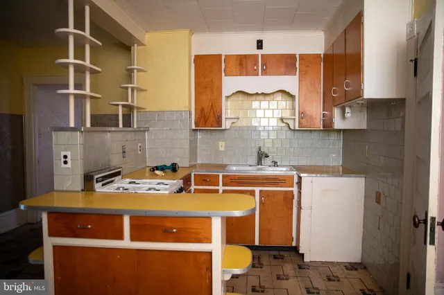 a white toilet sitting next to a shower