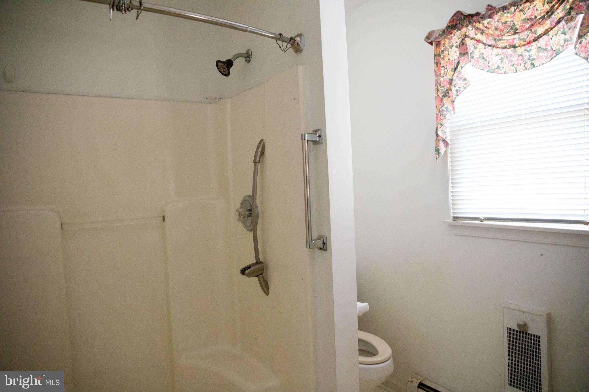 26121 Lewes Georgetown Highway Georgetown, DE 19947 - Photo 38 of 72 a bathroom with a shower and toilet