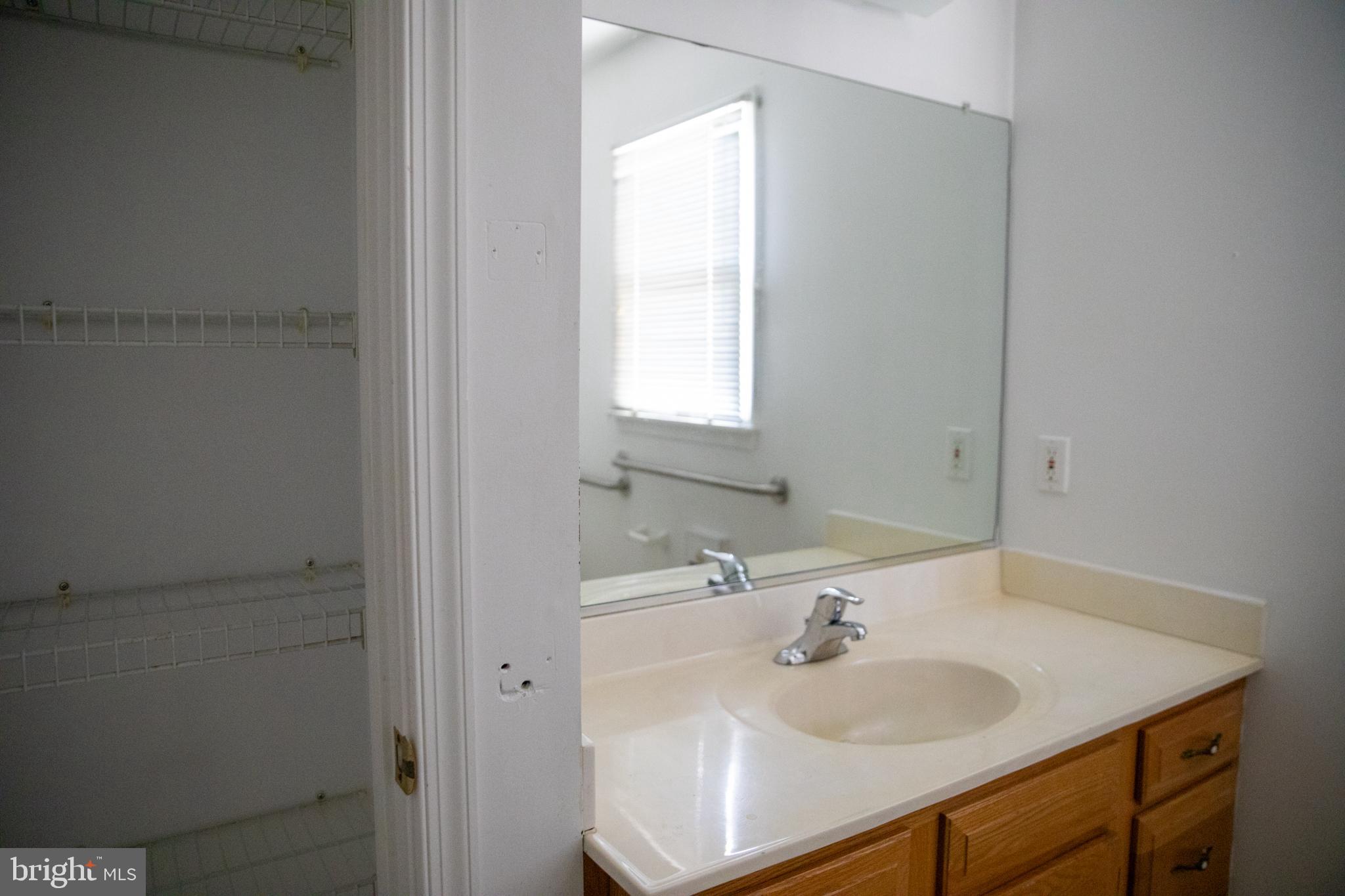 26121 Lewes Georgetown Highway Georgetown, DE 19947 - Photo 44 of 72 a bathroom with a sink and a window