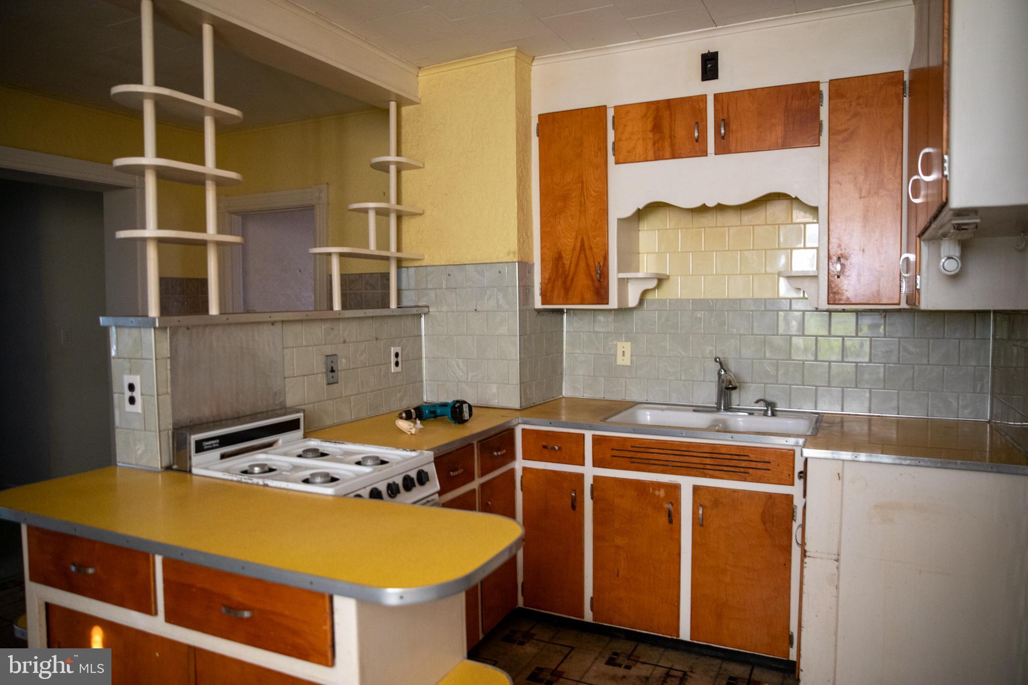 26121 Lewes Georgetown Highway Georgetown, DE 19947 - Photo 45 of 72 a kitchen with a sink and cabinets