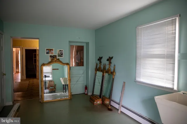 a view of front door with wooden floor