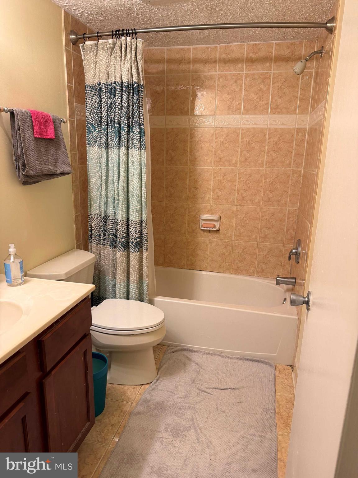 8007 Mandan Road, Unit 605 Greenbelt, MD 20770 - Photo 6 of 15 a bathroom with a toilet a sink and shower