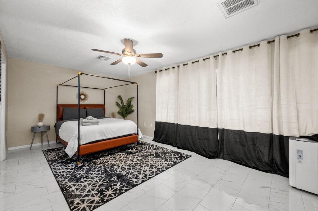 2504 Ferguson Way Houston, TX 77088 - Photo 12 of 32 a bedroom with a bed and a table