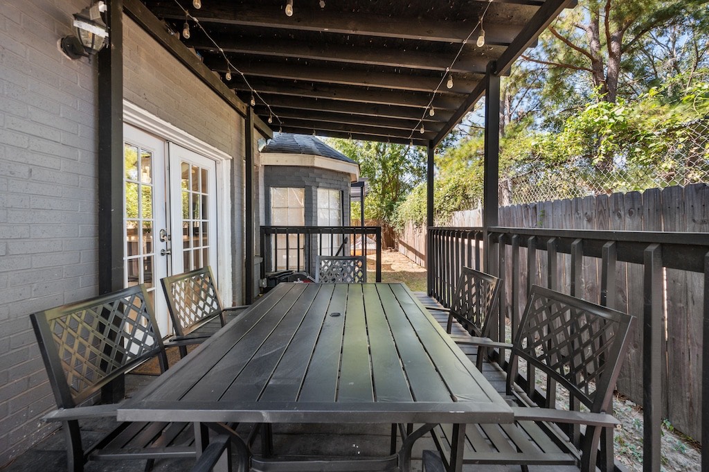 2504 Ferguson Way Houston, TX 77088 - Photo 30 of 32 a roof deck with wooden floor and outdoor seating