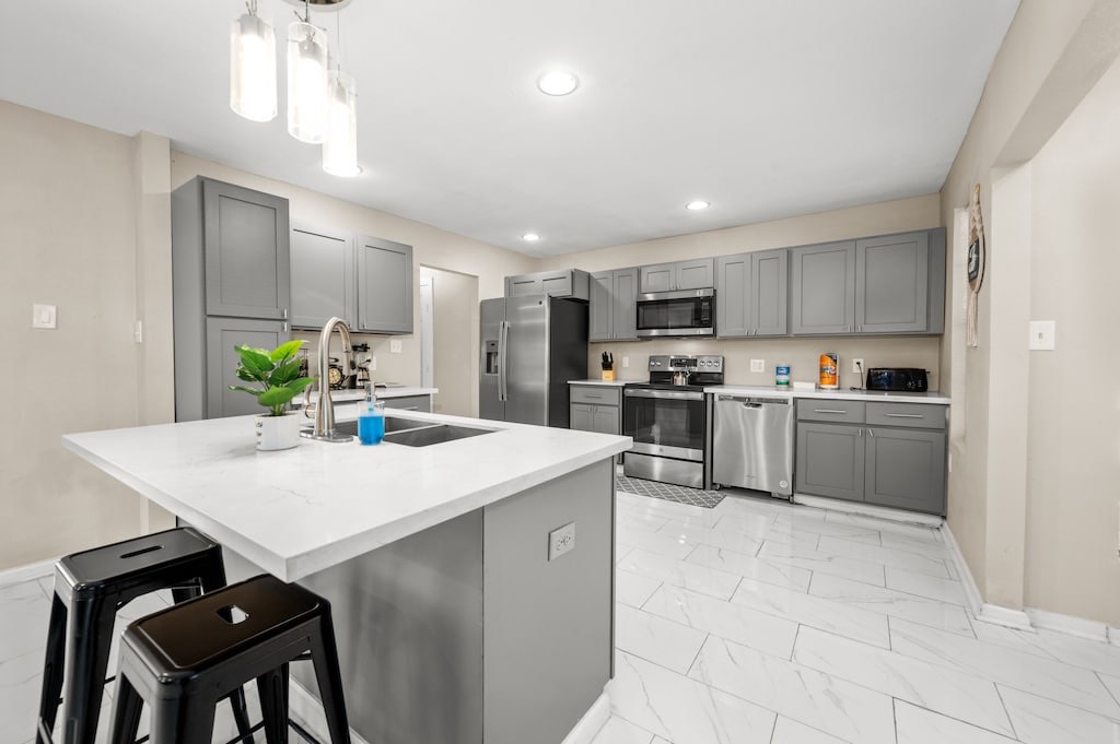 2504 Ferguson Way Houston, TX 77088 - Photo 9 of 32 a kitchen with kitchen island a sink appliances and cabinets